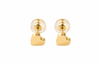 A pair of gold-tone heart stud earrings with clear round backings on a white background.