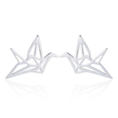 A pair of silver geometric cranes stud earrings on a clean white background with a soft reflection below.