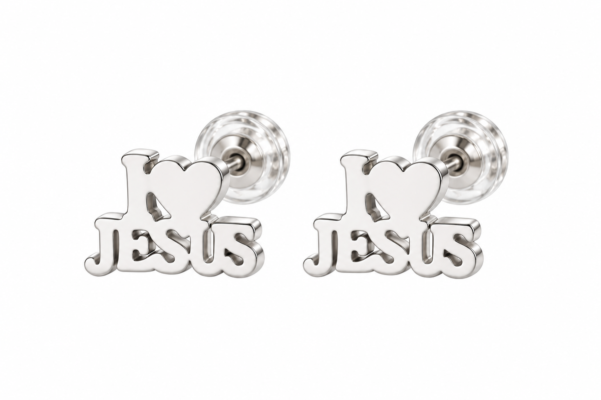 A pair of silver stud earrings featuring a heart-shaped top with the word 'Jesus' cut out below it, shown on a plain white background.