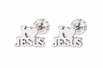 A pair of silver stud earrings featuring a heart-shaped top with the word 'Jesus' cut out below it, shown on a plain white background.