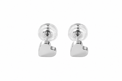 A pair of silver heart stud earrings with clear round backings, shown against a plain white background.