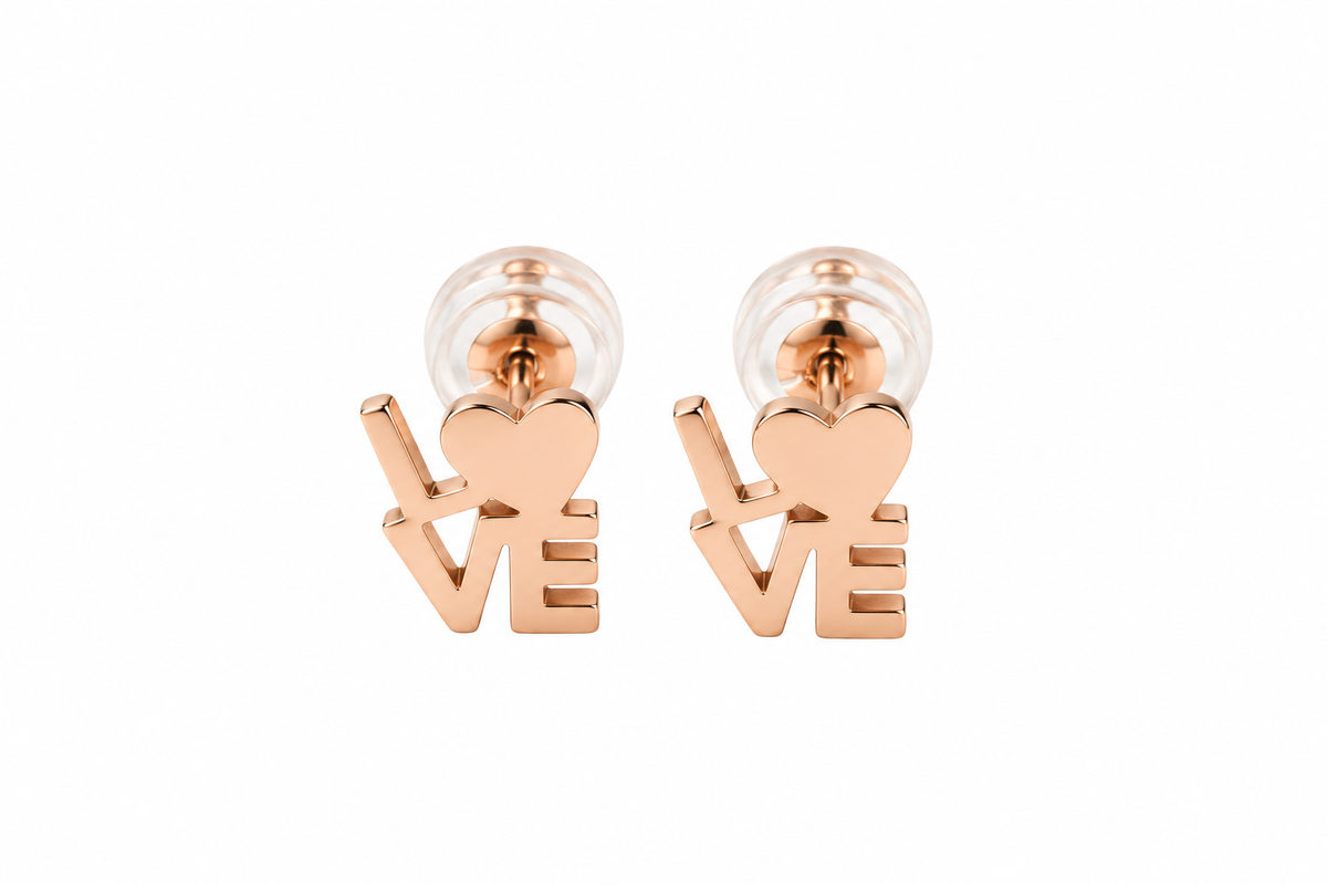 A pair of rose gold stud earrings shaped like the word 'LOVE', with the 'O' represented by a heart, shown on a plain white background.