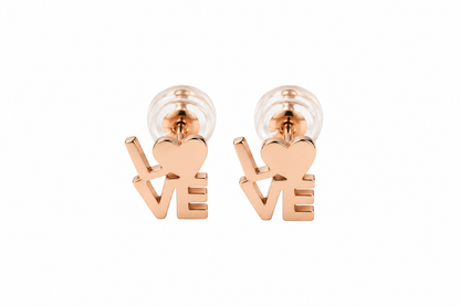 A pair of rose gold stud earrings shaped like the word 'LOVE', with the 'O' represented by a heart, shown on a plain white background.