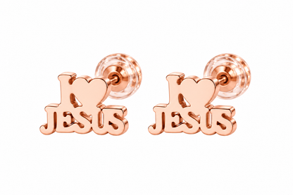 A pair of rose gold stud earrings featuring a heart and the word 'JESUS' in a stylized script, shown on a plain white background.