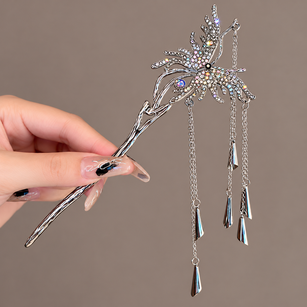 Ornate silver-tone butterfly hair stick featuring sparkling dark metallic wings, a sculpted branch stem, and cascading teardrop pendants.